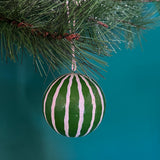 green white christmas ornaments on a blue background