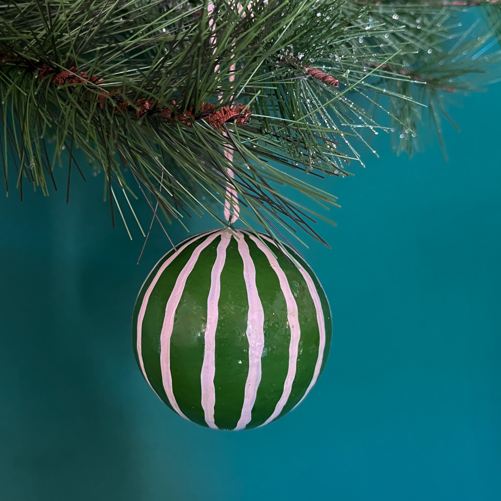 green white christmas ornaments on a blue background