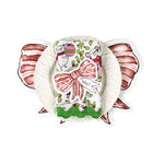 Christmas tea towel place setting with striped bow place card featuring the name Mabel, layered on a white scalloped plate with festive holiday illustrations.