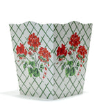 a red and white geranium wastepaper basket in "cottage Grove" pattern by madcap cottage.