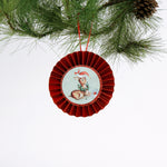 retro-style ruffled paper Christmas ornaments featuring vintage illustration, accented with red pleated borders and hanging ribbons