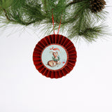 retro-style ruffled paper Christmas ornaments featuring vintage illustration, accented with red pleated borders and hanging ribbons