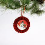 retro-style ruffled paper Christmas ornaments featuring vintage illustration, accented with red pleated borders and hanging ribbons
