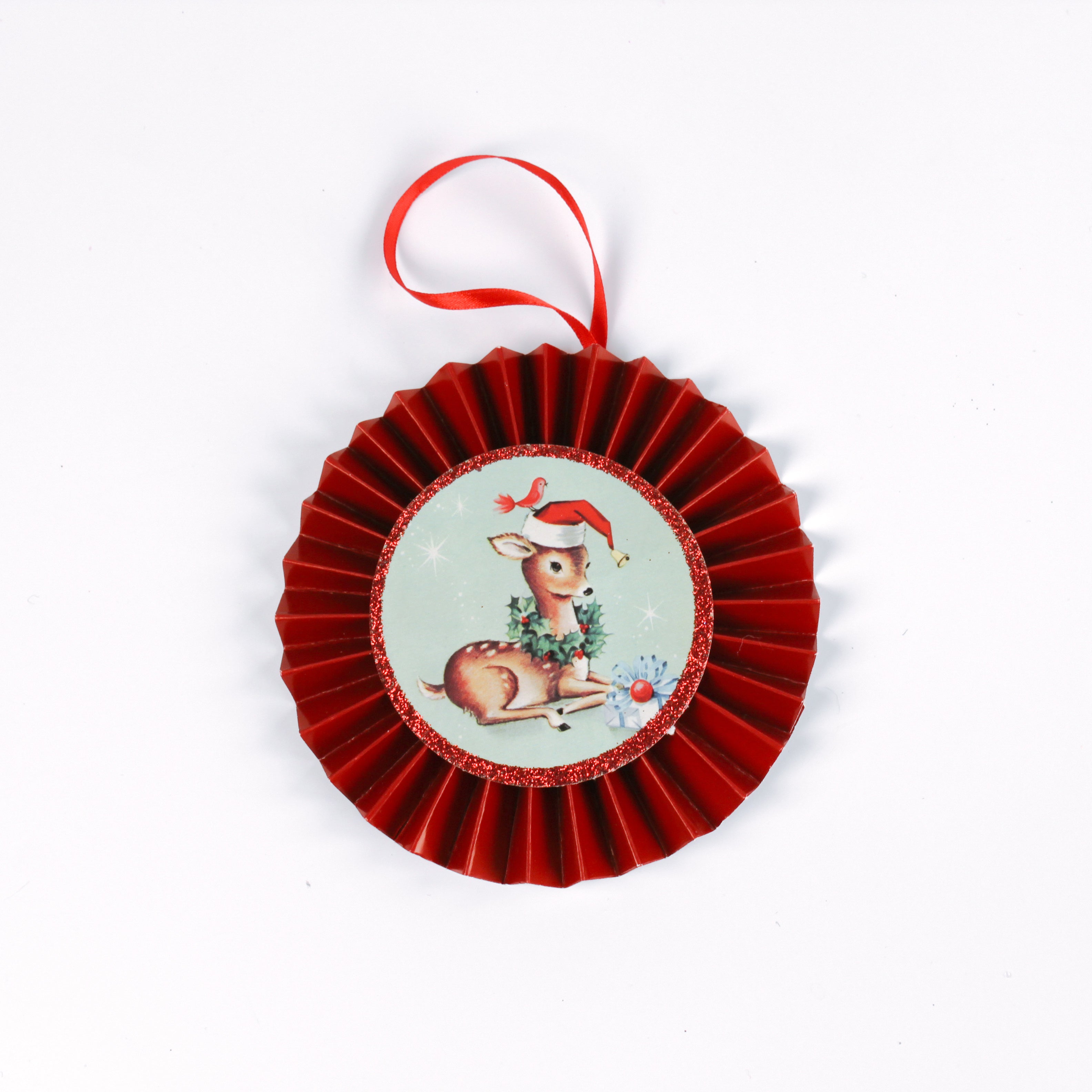 retro-style ruffled paper Christmas ornaments featuring vintage illustration, accented with red pleated borders and hanging ribbons