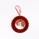 retro-style ruffled paper Christmas ornaments featuring vintage illustration, accented with red pleated borders and hanging ribbons