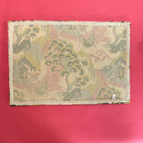 Reverse side of a pink green and blue rug with chinoiserie motifs