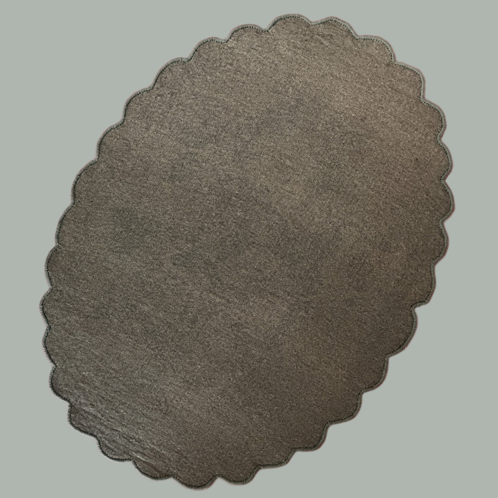 The reverse side of an oval scalloped rug