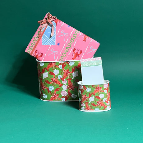 Rock Lobster filled duo of caddies in large and small on a green background