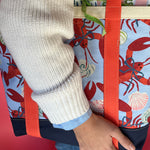 Detail of the large Rock Lobster canvas tote bag with red straps