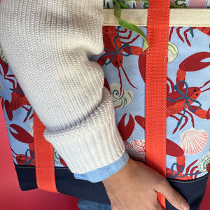 Detail of the large Rock Lobster canvas tote bag with red straps
