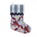 blue christmas Stocking with coastal lobster design and a blue gingham cuff on a white background