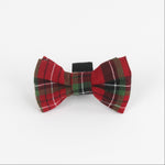 a Royal Stewart Red/Green Plaid Dog/Cat Bowties in Medium placed on a white surface