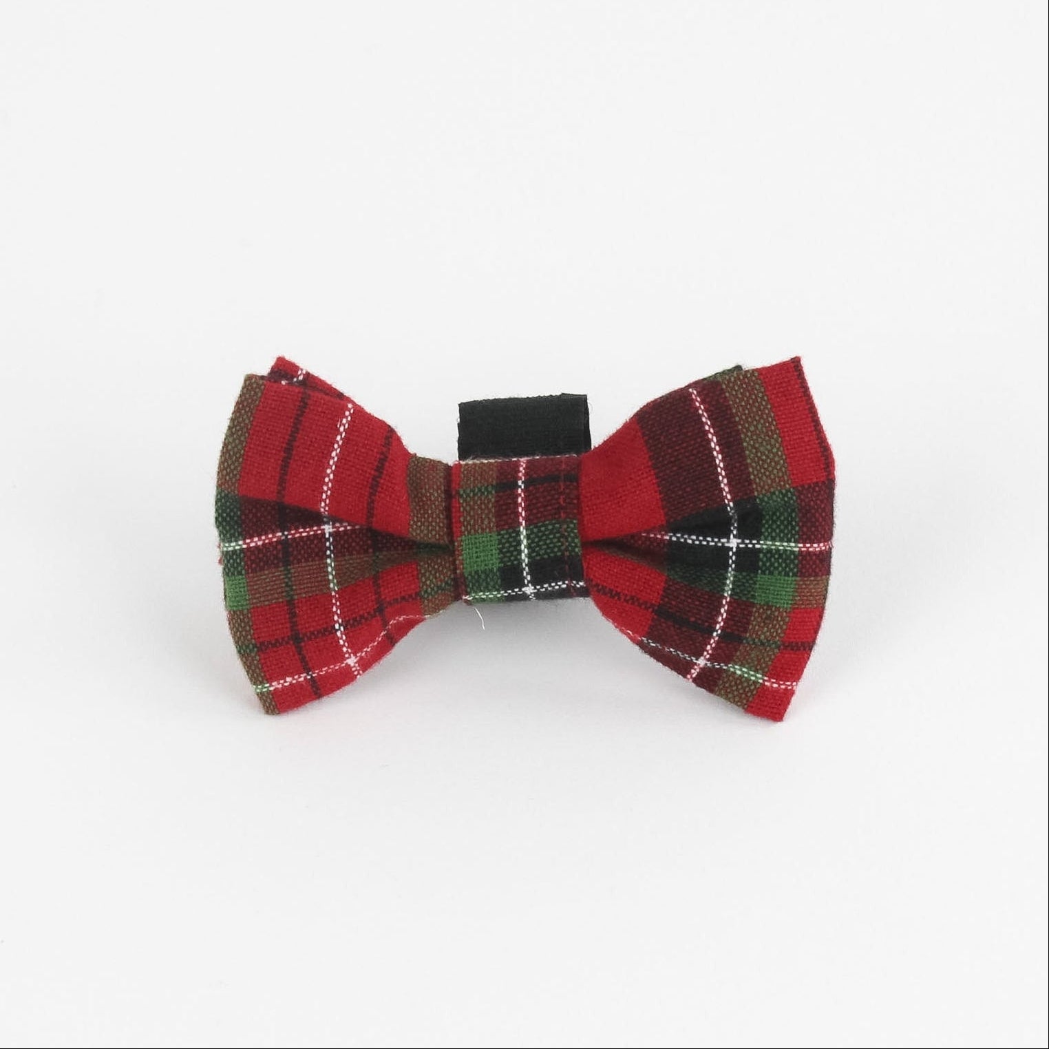 a Royal Stewart Red/Green Plaid Dog/Cat Bowties in Medium placed on a white surface
