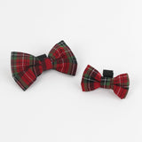 2 Royal Stewart Red/Green Plaid Dog/Cat Bowties in Medium and Large placed on a white surface