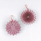 back of Set of two ruffled paper Christmas ornaments in shimmering green and purple glitter with red centers