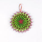 ruffled paper Christmas ornaments in shimmering green and purple glitter with red centers