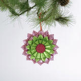 ruffled paper Christmas ornaments in shimmering green and purple glitter with red centers