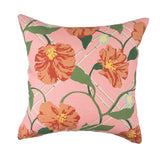 Pink tropical outdoor pillow with vibrant orange floral accents.