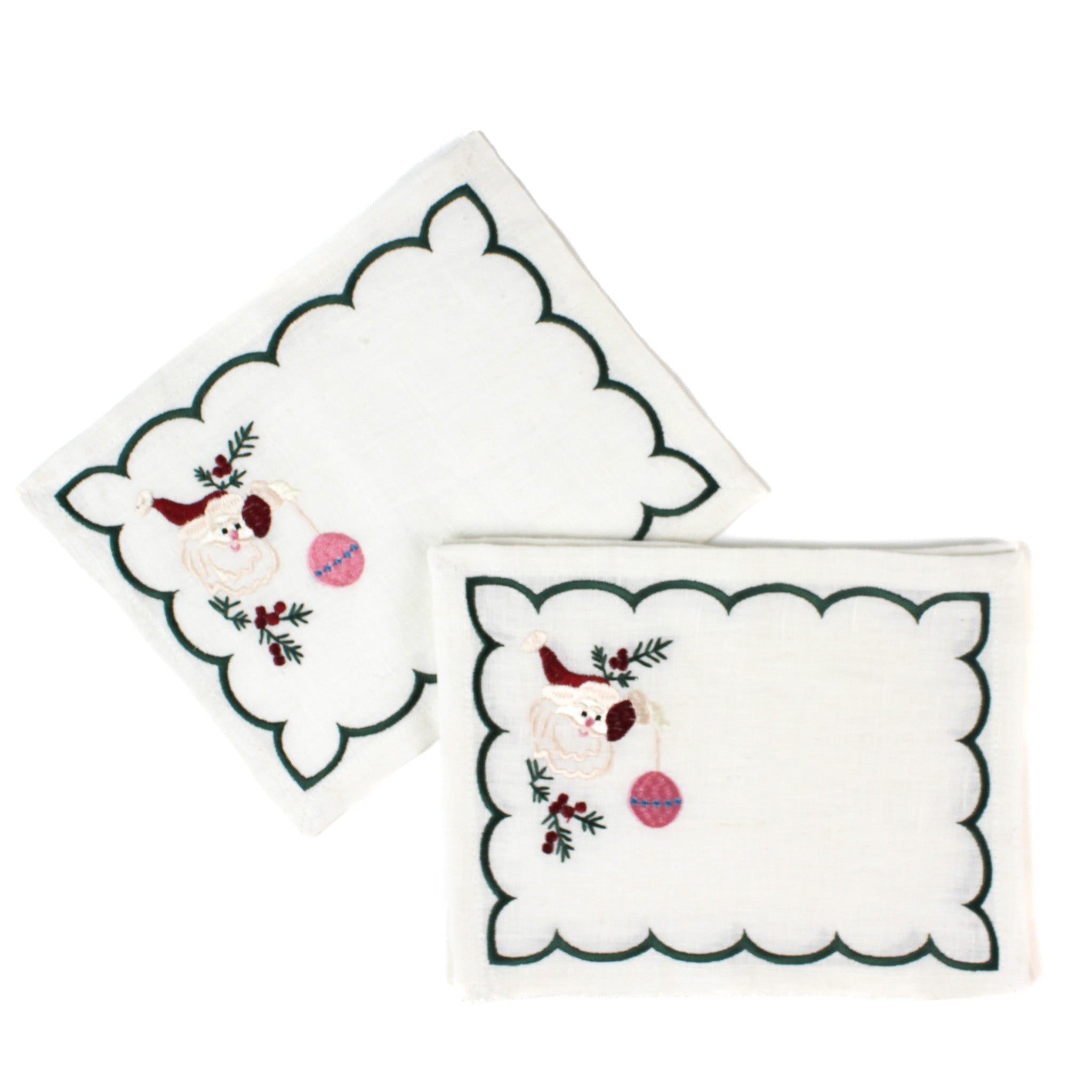 white scalloped cocktail napkins with embroidered Santa and holly design