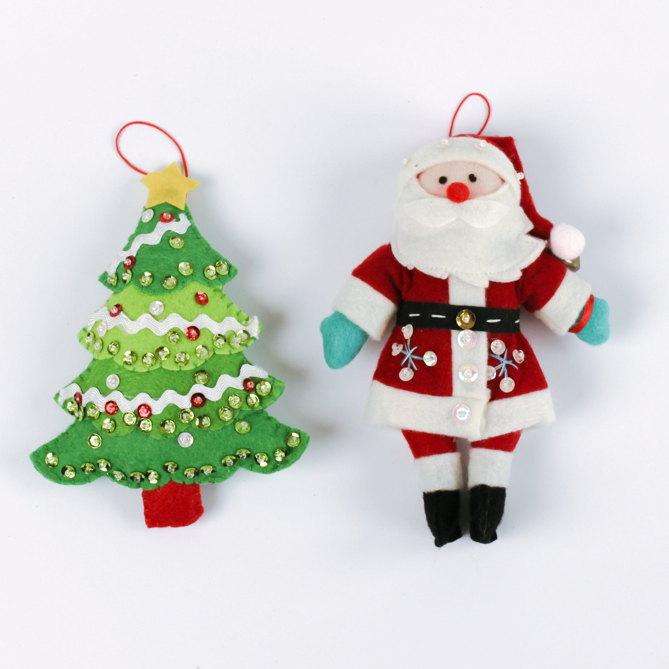 2 felt Christmas ornaments featuring a sequined green Christmas tree and a jolly Santa Claus in a red suit