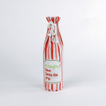 Madcap Cottage Red and white striped bottle bag with a text "Be Naughty! Save Santa the trip" on a white background