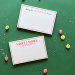 2 Luxe large notepad with quote ‘Bring the Adventure Home’ and "More of more is wonderful" in blue and red typography, bordered with dotted design for chic desk stationery. placed in a white background