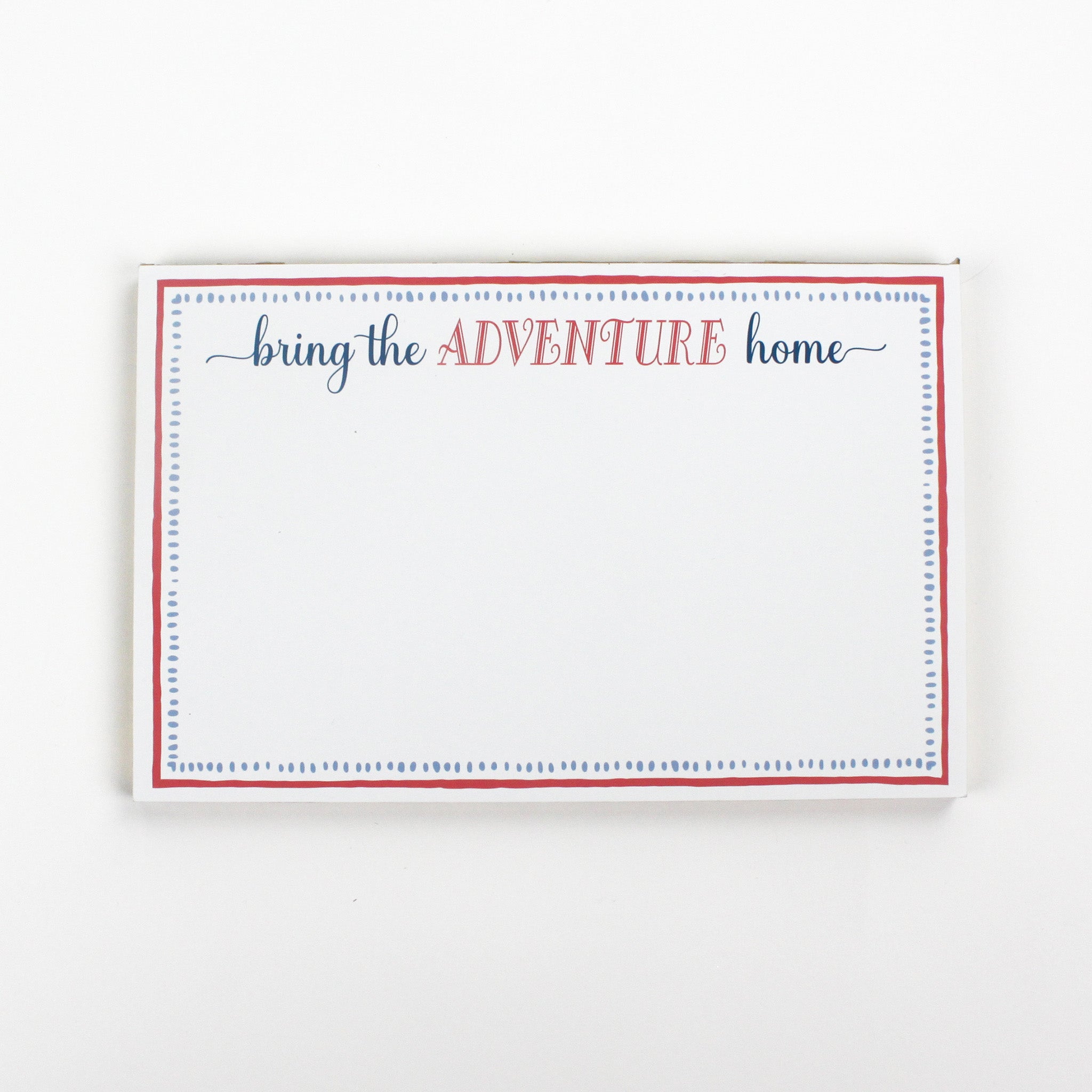 Luxe large notepad with quote ‘Bring the Adventure Home’ in blue and red typography, bordered with dotted design for chic desk stationery. placed in a white background