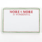 Luxe large notepad with quote ‘More of More is Wonderful’ in red lettering, featuring a dotted border and green trim, perfect for stylish note-taking. placed in a white background