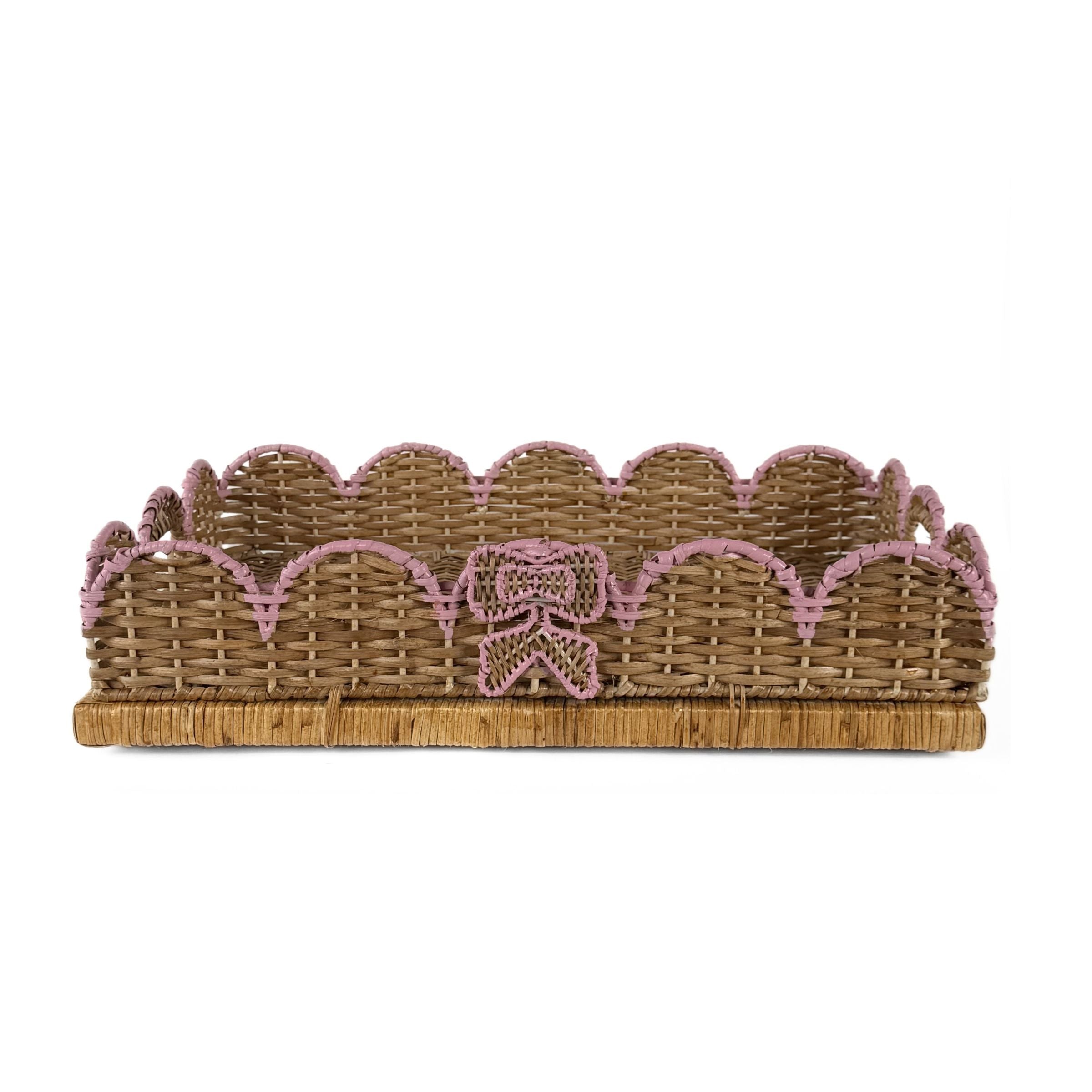 Scalloped hand-painted pink rattan tray with decorative ribbon detail and woven design.