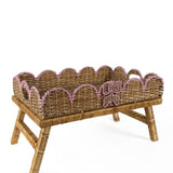 Scalloped hand-painted pink rattan tray side view with decorative ribbon detail and raised stand.