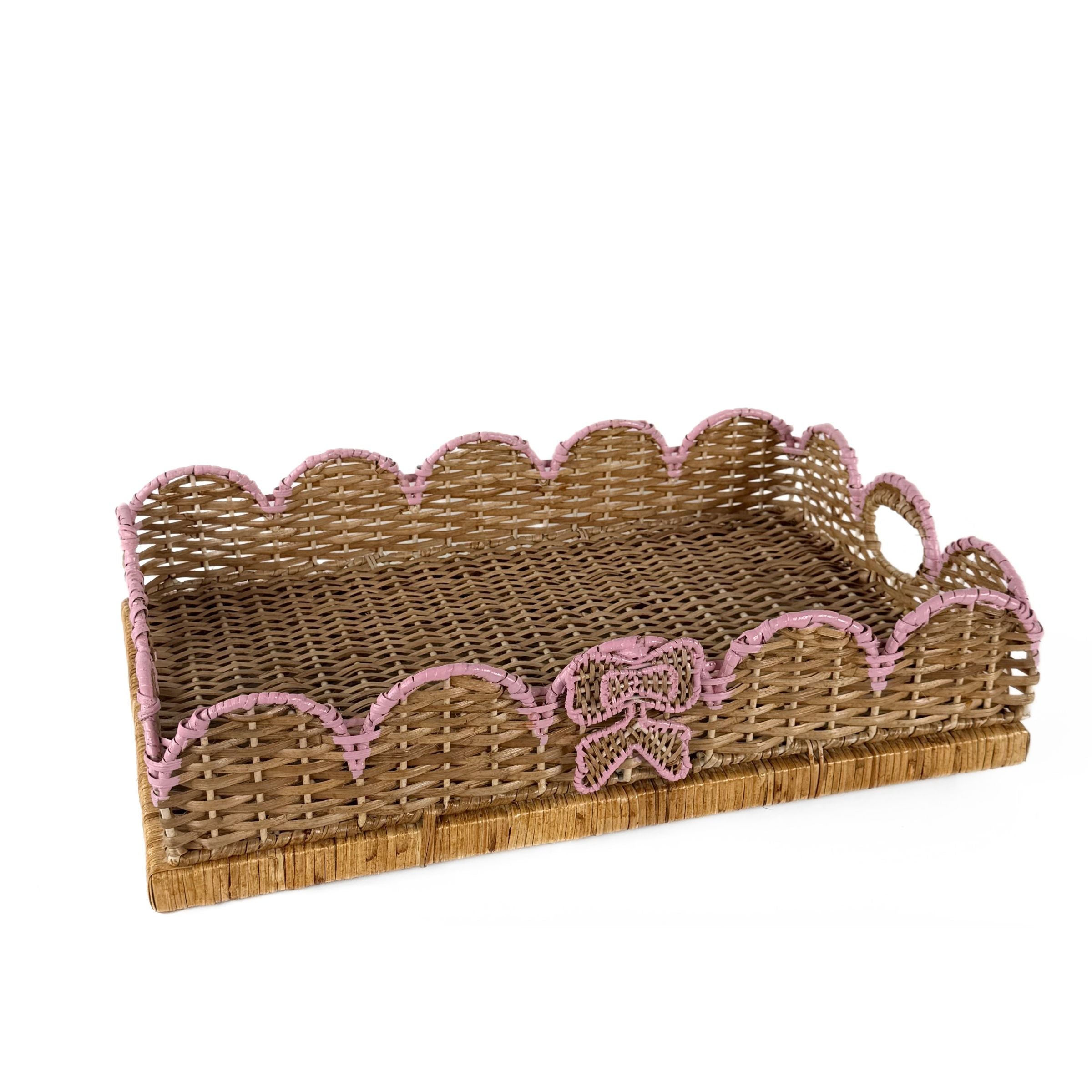 Scalloped pink rattan tray with hand-painted ribbon detail.