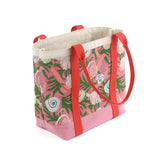 large Shell Seekers canvas tote bags with pink fabric with a repeating seaweed and shell motif.
