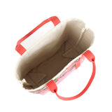 the image shows the inside of a large Shell Seekers canvas tote bags with pink fabric with a repeating seaweed and shell motif.