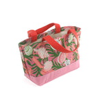 small Shell Seekers canvas tote bags with pink fabric with a repeating seaweed and shell motif.