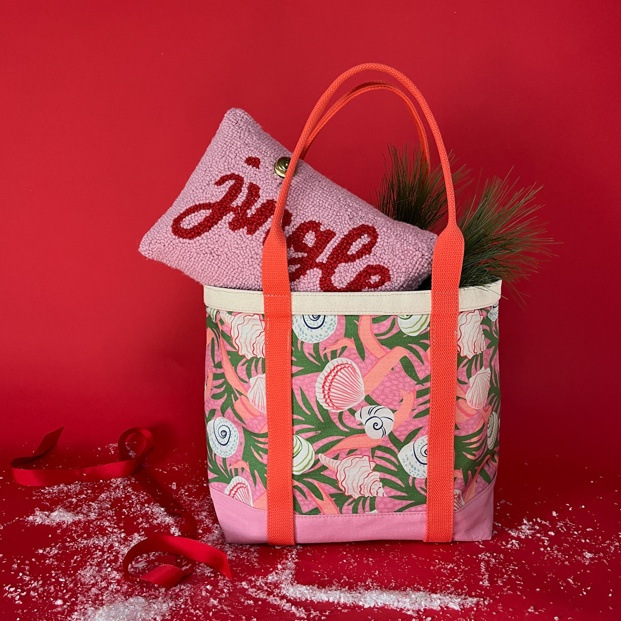 Shell Seekers canvas large tote bag with pink fabric with a repeating seaweed and shell motif with a pillow sticking out of top