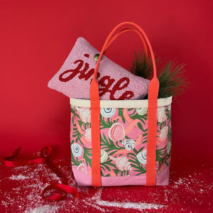 Shell Seekers canvas large tote bag with pink fabric with a repeating seaweed and shell motif with a pillow sticking out of top