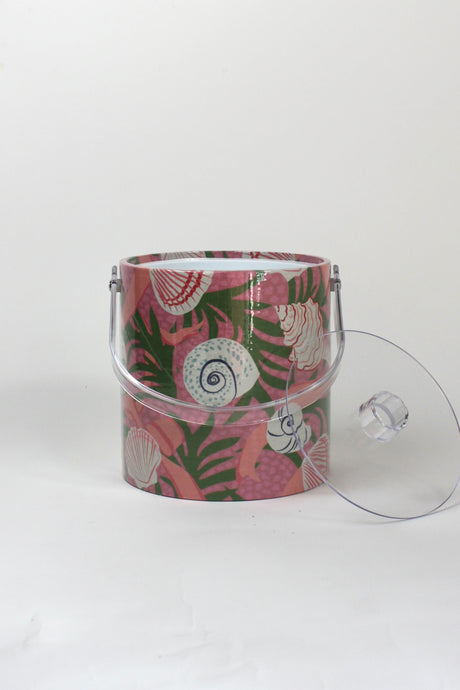 Shell Seekers, a pink acrylic ice bucket from madcap cottage covered in shell and seaweed motifs