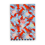 Shells and Lobsters cotton tea towel featuring vibrant red lobsters and colorful seashells on a light blue background.