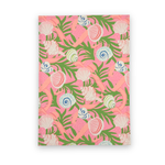 Shells and Ribbons cotton tea towel featuring colorful seashells, pink ribbons, and green tropical foliage on a vibrant pink background.