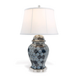 A navy table lamp with a navy blue patterned base and white shade.