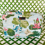 Side view of Meadow Club toiletry bag in sky blue features a lily pond pattern