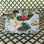 Side view of Meadow Club toiletry bag in sky blue features a lily pond pattern