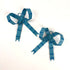 pair of small blue striped bow ornaments with loop hangers