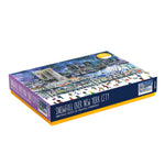 Angled view of the “Snowfall Over New York City” 1000-piece puzzle box featuring a winter city scene.