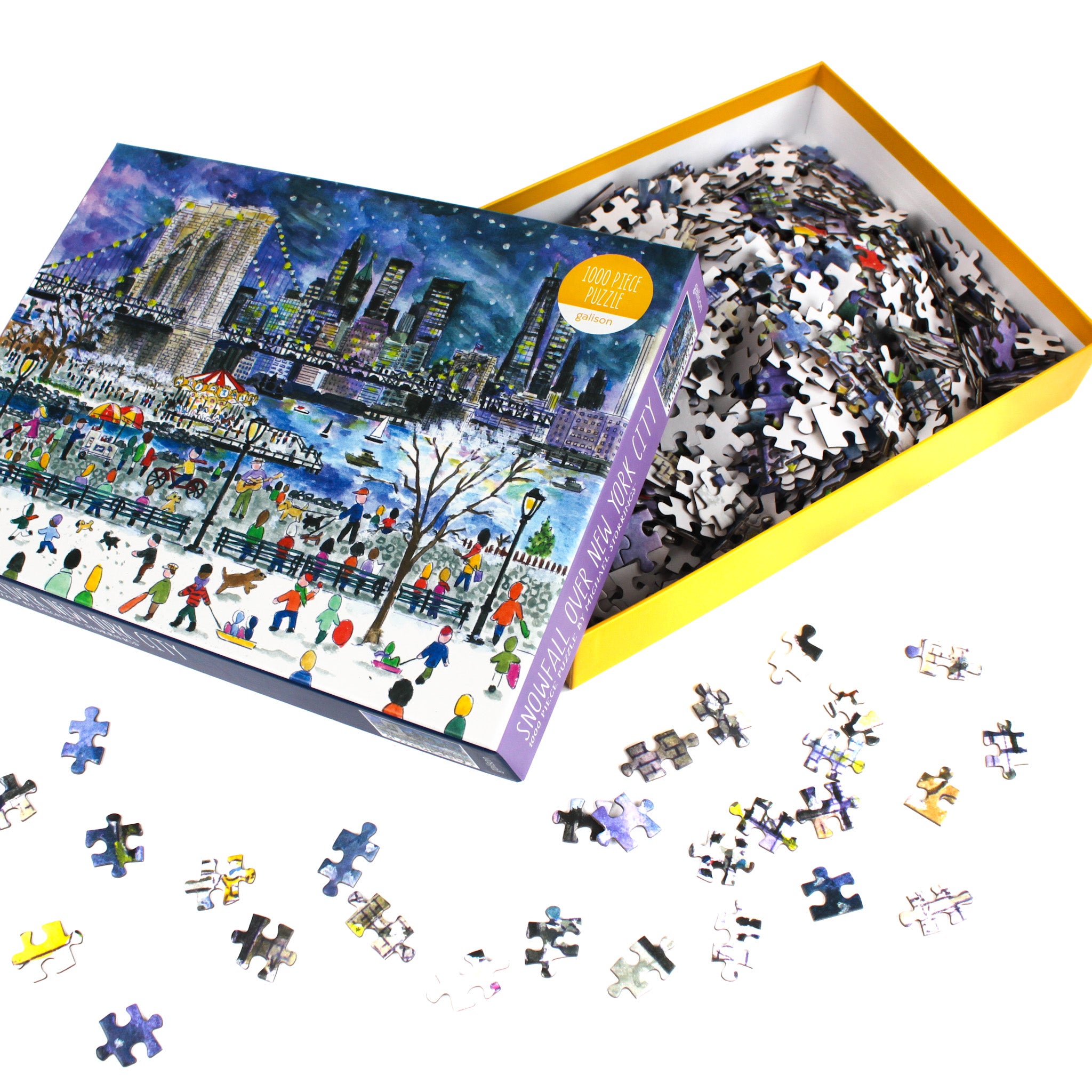 Open “Snowfall Over New York City” puzzle box with loose pieces spilling out on a white surface.