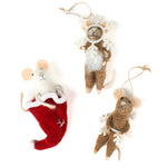 Three felt mouse ornaments, one peeking out of a red Christmas stocking and two wearing white snowflake costume frames, shown lying flat.