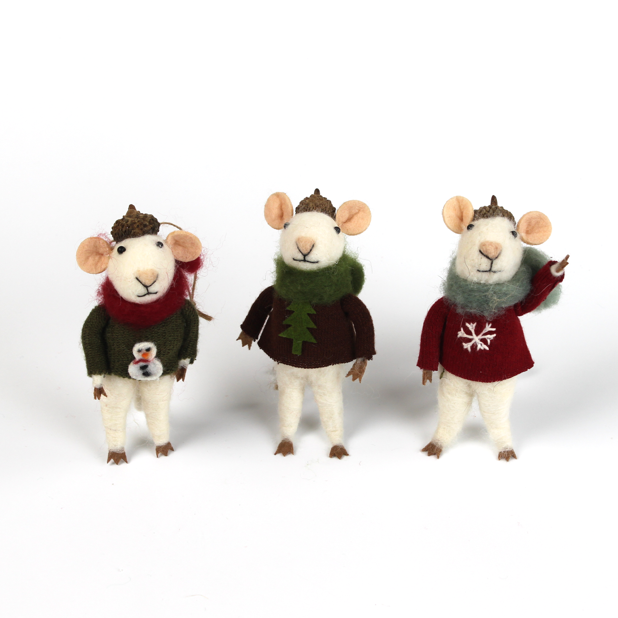 Three felt mouse ornaments wearing cozy sweaters with festive designs—a snowman, a tree, and a snowflake—each topped with a tiny acorn cap and ready to hang.