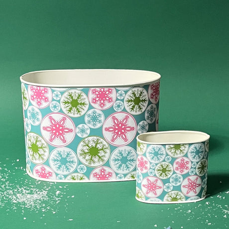 Empty duo of Snowflake Wonderland Christmas caddies in large and small on a green background