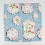 cloth napkins featuring a blue background with vintage floral plate designs.