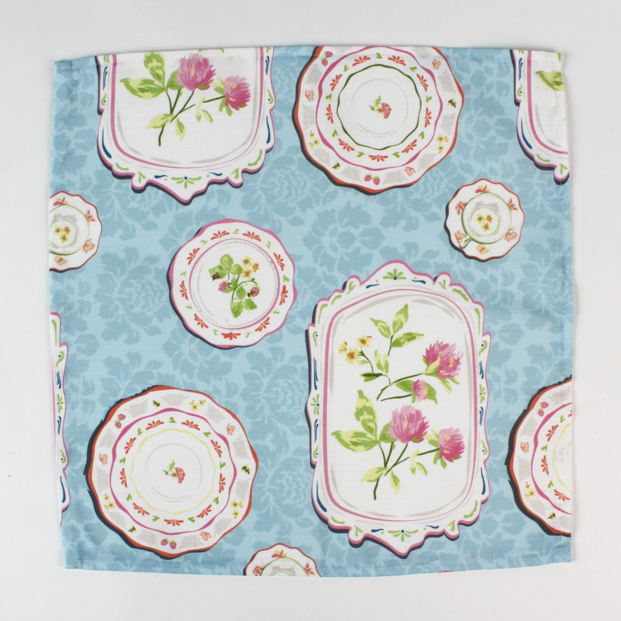 cloth napkins featuring a blue background with vintage floral plate designs.